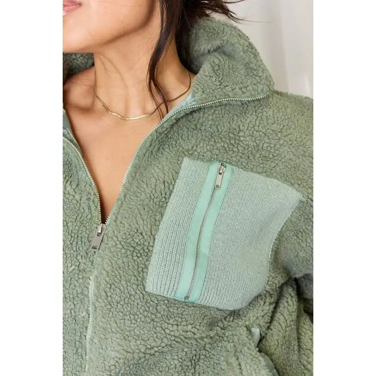 This cozy and chic jacket is a must-have for the colder months featuring soft luxurious sage sherpa fabric