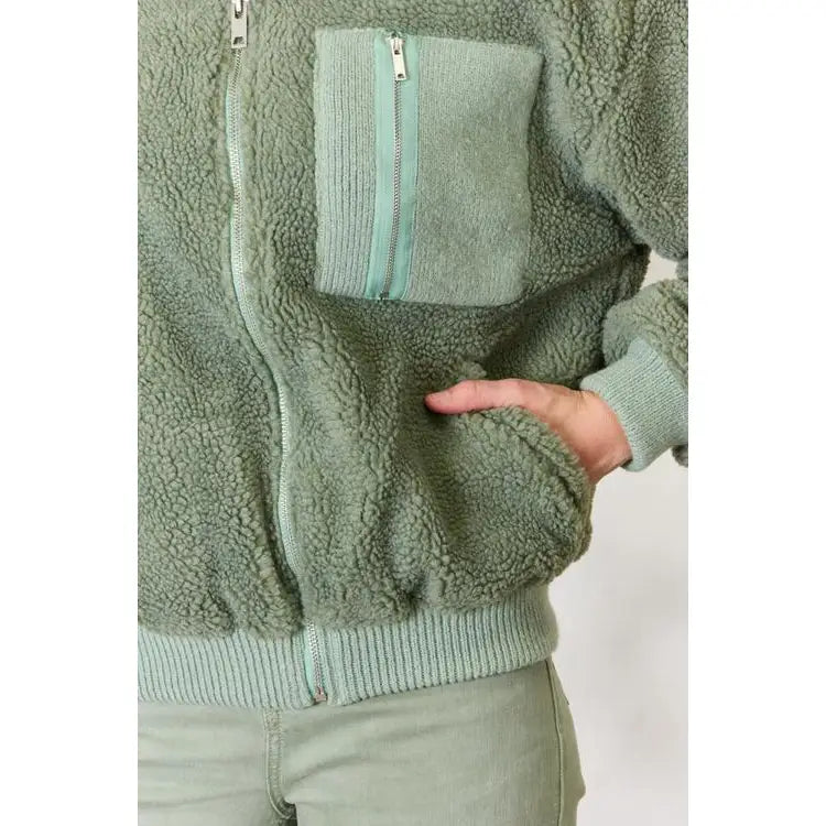 This cozy and chic jacket is a must-have for the colder months featuring soft luxurious sage sherpa fabric
