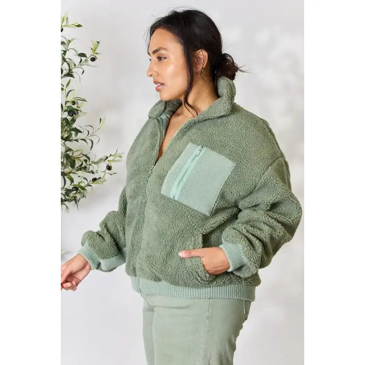This cozy and chic jacket is a must-have for the colder months featuring soft luxurious sage sherpa fabric