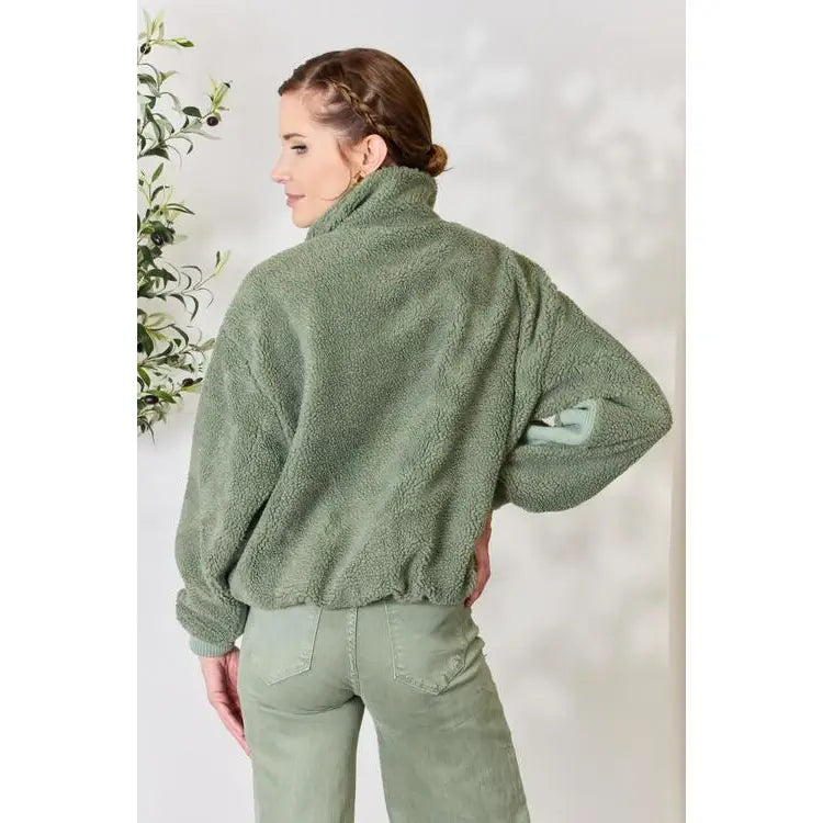 This cozy and chic jacket is a must-have for the colder months featuring soft luxurious sage sherpa fabric