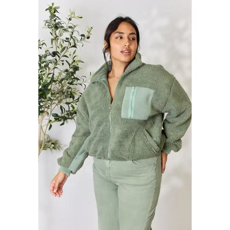 This cozy and chic jacket is a must-have for the colder months featuring soft luxurious sage sherpa fabric