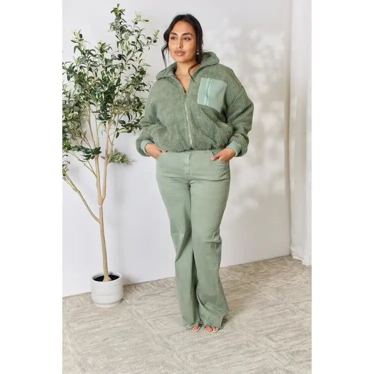 This cozy and chic jacket is a must-have for the colder months featuring soft luxurious sage sherpa fabric