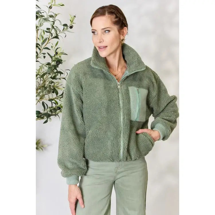 This cozy and chic jacket is a must-have for the colder months featuring soft luxurious sage sherpa fabric