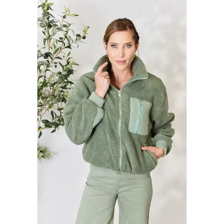 This cozy and chic jacket is a must-have for the colder months featuring soft luxurious sage sherpa fabric