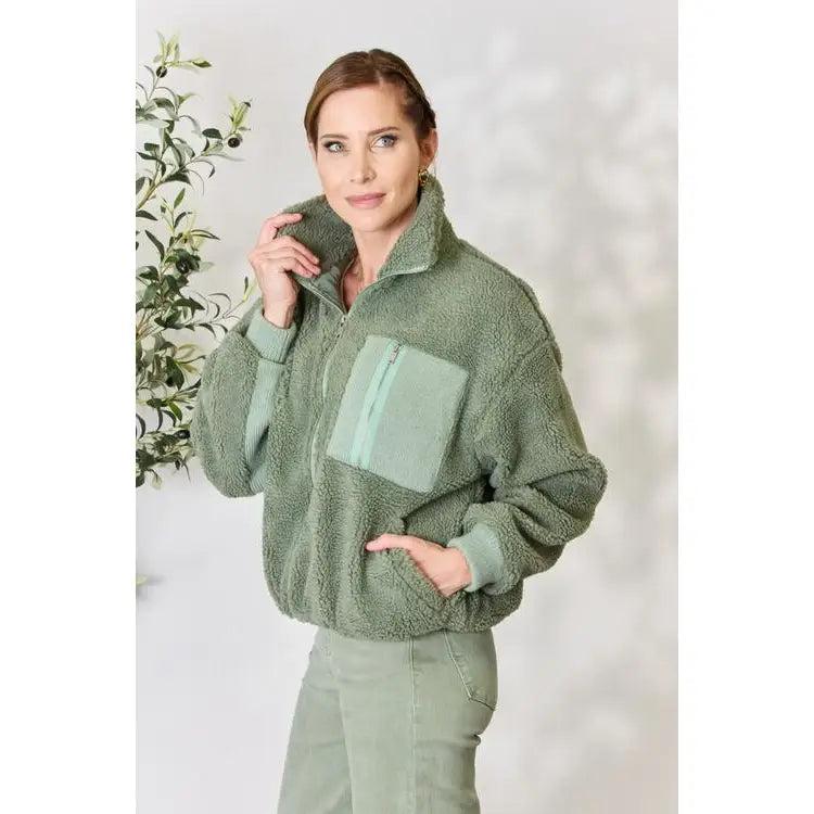 This cozy and chic jacket is a must-have for the colder months featuring soft luxurious sage sherpa fabric