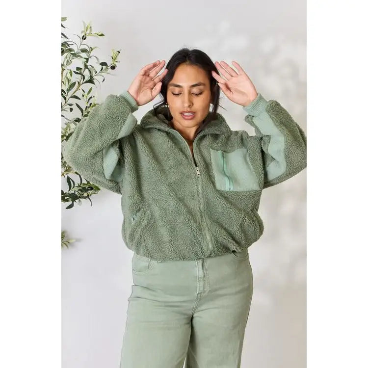 This cozy and chic jacket is a must-have for the colder months featuring soft luxurious sage sherpa fabric
