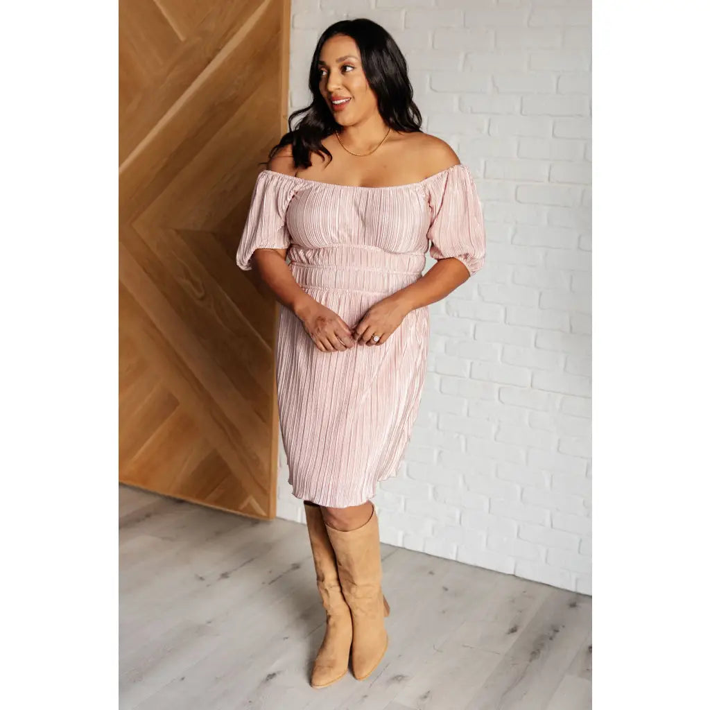 Shop this blush satin plisse mini dress with off shoulder option and flattering fit. Available in plus sizes