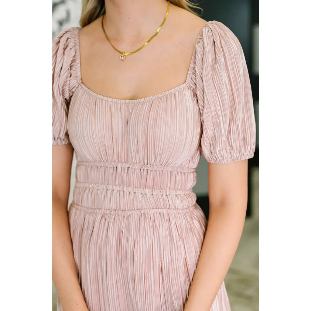 Shop this blush satin plisse mini dress with off shoulder option and flattering fit. Available in plus sizes