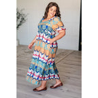 Look at life differently in our Kaleidoscope Print V-Neck Midi Dress. Crafted from luxurious crinkle woven fabric