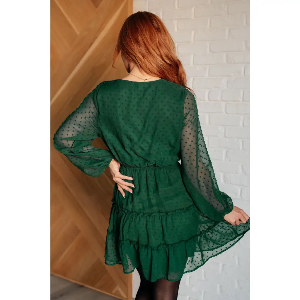 Polka dot tiered mini dress in hunter green with ruffles and lining. A plus size friendly holiday look playful sleeves