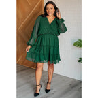 Polka dot tiered mini dress in hunter green with ruffles and lining. A plus size friendly holiday look playful sleeves