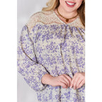 Our Lace in Detail Printed Blouse is a feminine and stylish top that combines the delicate lace accents beautiful lilac