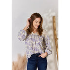 Our Lace in Detail Printed Blouse is a feminine and stylish top that combines the delicate lace accents beautiful lilac