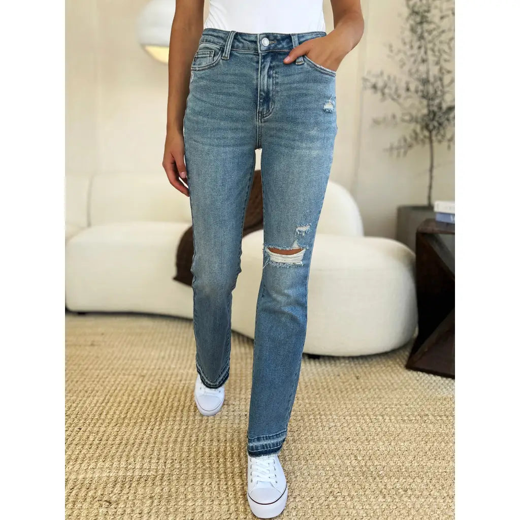 Our Laid Back Mid Rise Destroyed Hem Judy Blue Jeans are a trendy and edgy addition to your distressed denim