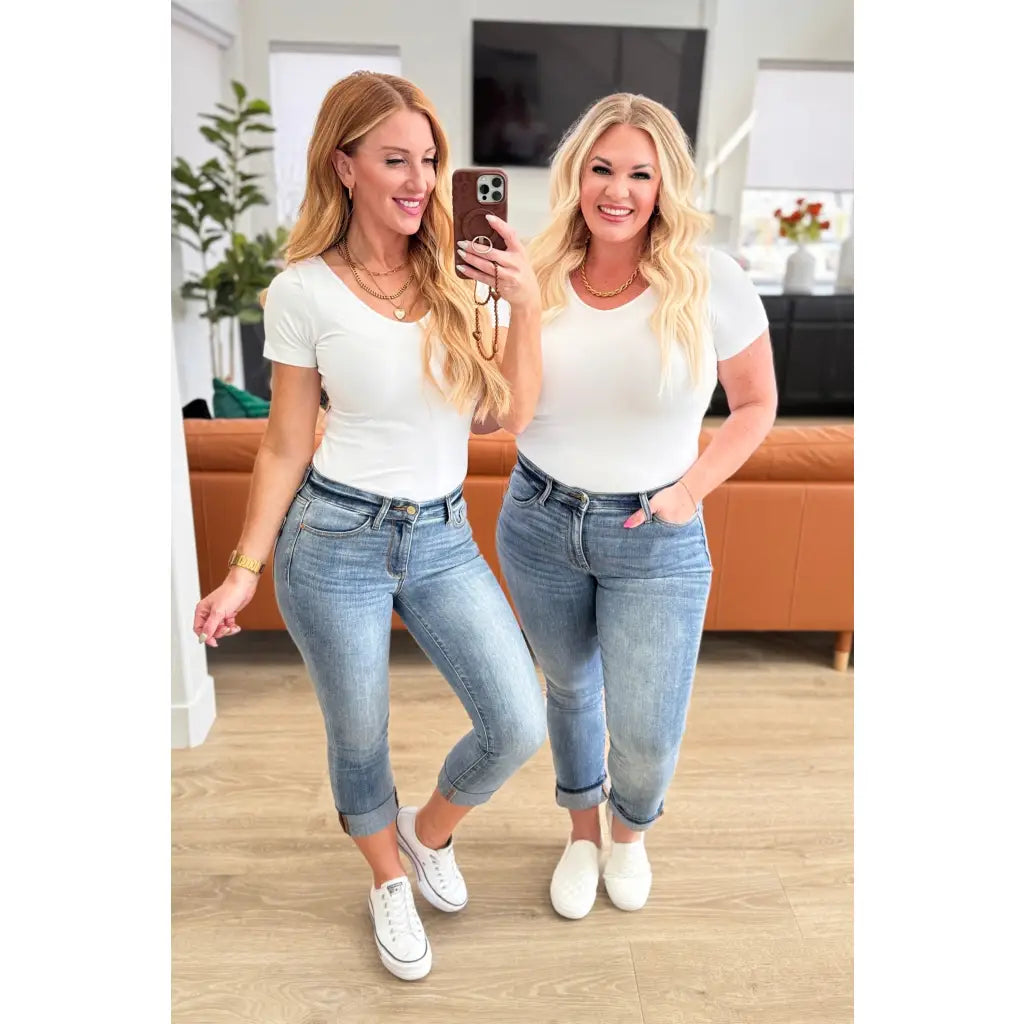 Introducing our Laura Mid Rise Cuffed Skinny Capri Jeans by Judy Blue your new go-to 4-way stretchy denim. The mid rise