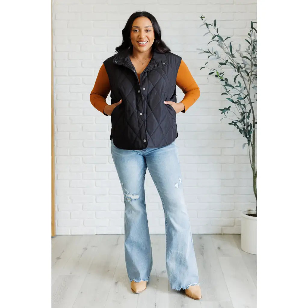 Our Layering Queen Puffer Vest is made from a black quilted windbreaker material. This vest will keep you warm