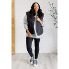 Our Layering Queen Puffer Vest is made from a black quilted windbreaker material. This vest will keep you warm