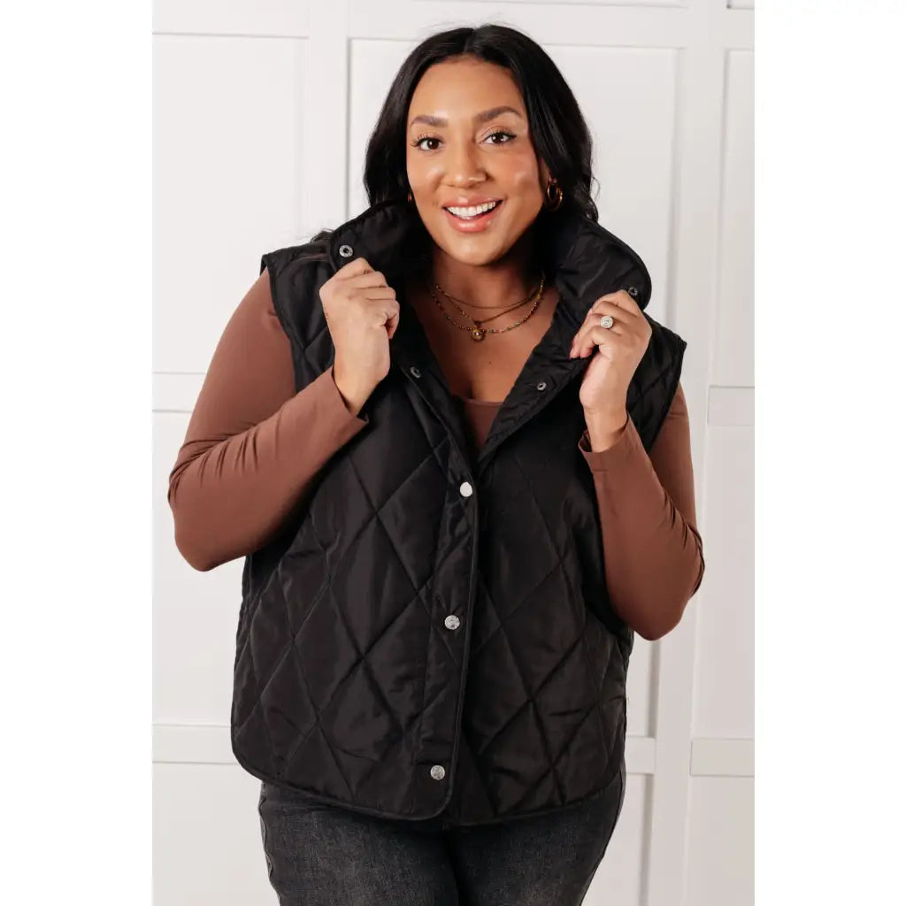 Our Layering Queen Puffer Vest is made from a black quilted windbreaker material. This vest will keep you warm