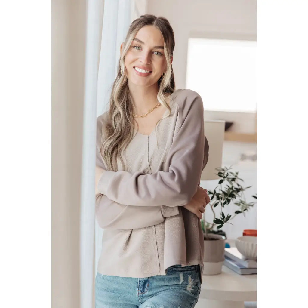 Stay effortlessly stylish with the Less Conversation V-Neck Top in beige. Featuring a textured knit and notched v-neck.