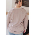 Stay effortlessly stylish with the Less Conversation V-Neck Top in beige. Featuring a textured knit and notched v-neck.