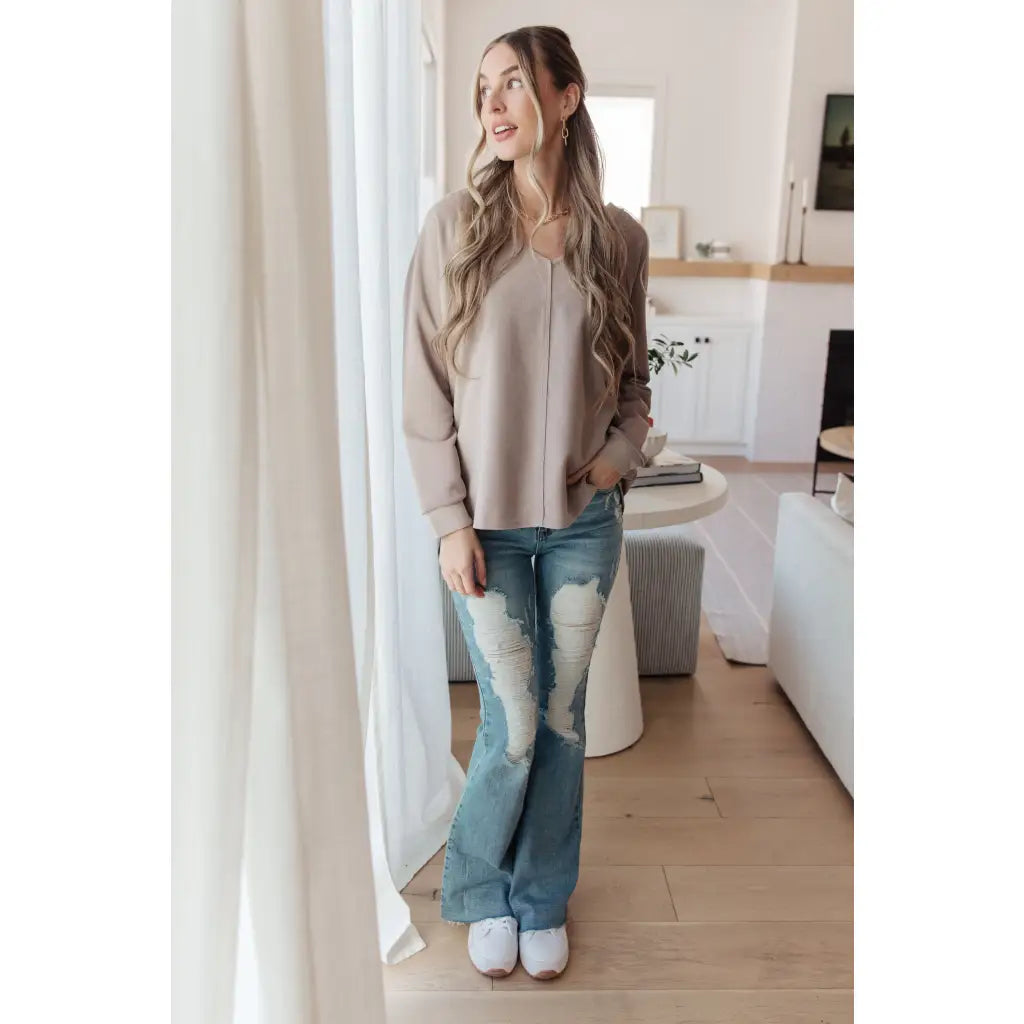 Stay effortlessly stylish with the Less Conversation V-Neck Top in beige. Featuring a textured knit and notched v-neck.