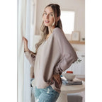 Stay effortlessly stylish with the Less Conversation V-Neck Top in beige. Featuring a textured knit and notched v-neck.