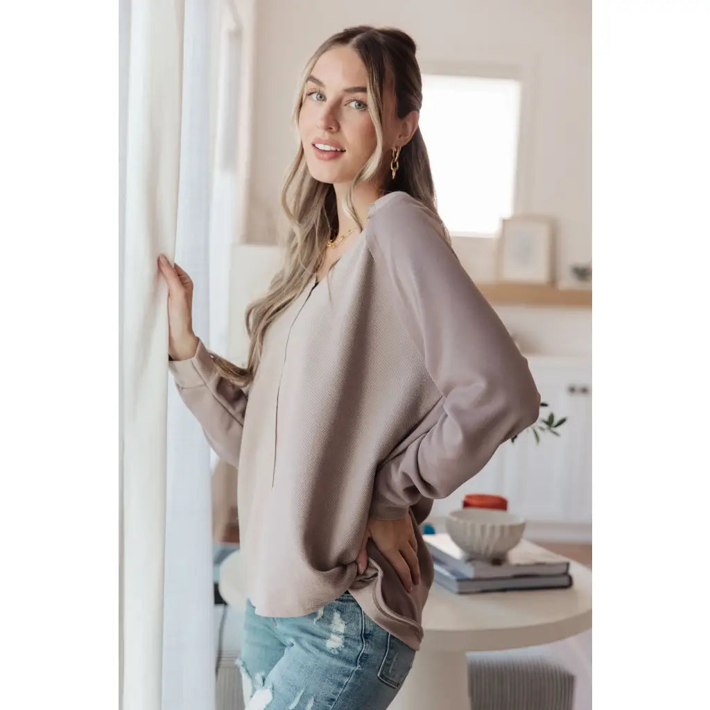 Stay effortlessly stylish with the Less Conversation V-Neck Top in beige. Featuring a textured knit and notched v-neck.