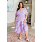 Lilac tiered midi dress with ruffle sleeves sweetheart neckline and open back. S to 3XL. Ships fast in 2–3 days.