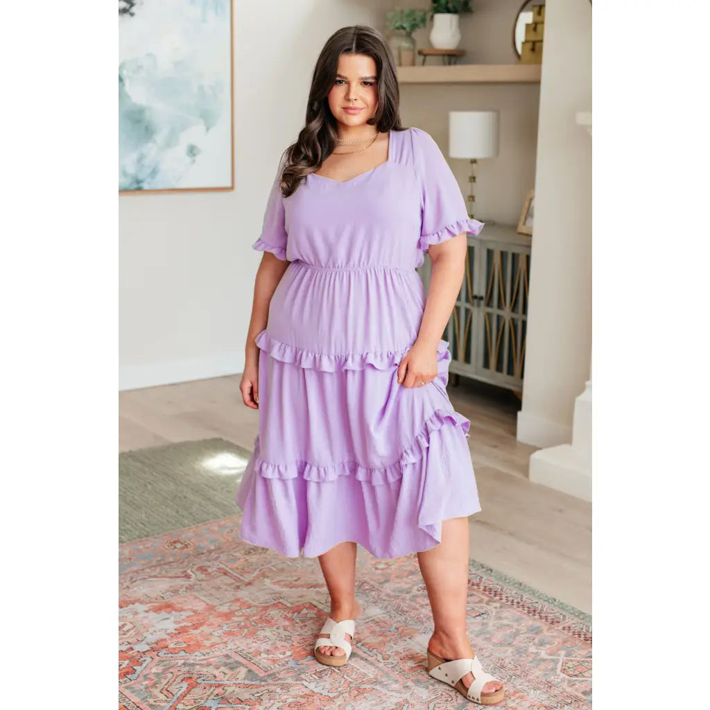 Lilac tiered midi dress with ruffle sleeves sweetheart neckline and open back. S to 3XL. Ships fast in 2–3 days.