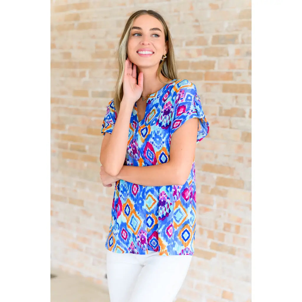 Our Lizzy Cap Sleeve Top in Blue and Magenta Ikat is crafted from light-weight cooling stretchy wrinkle-resistant