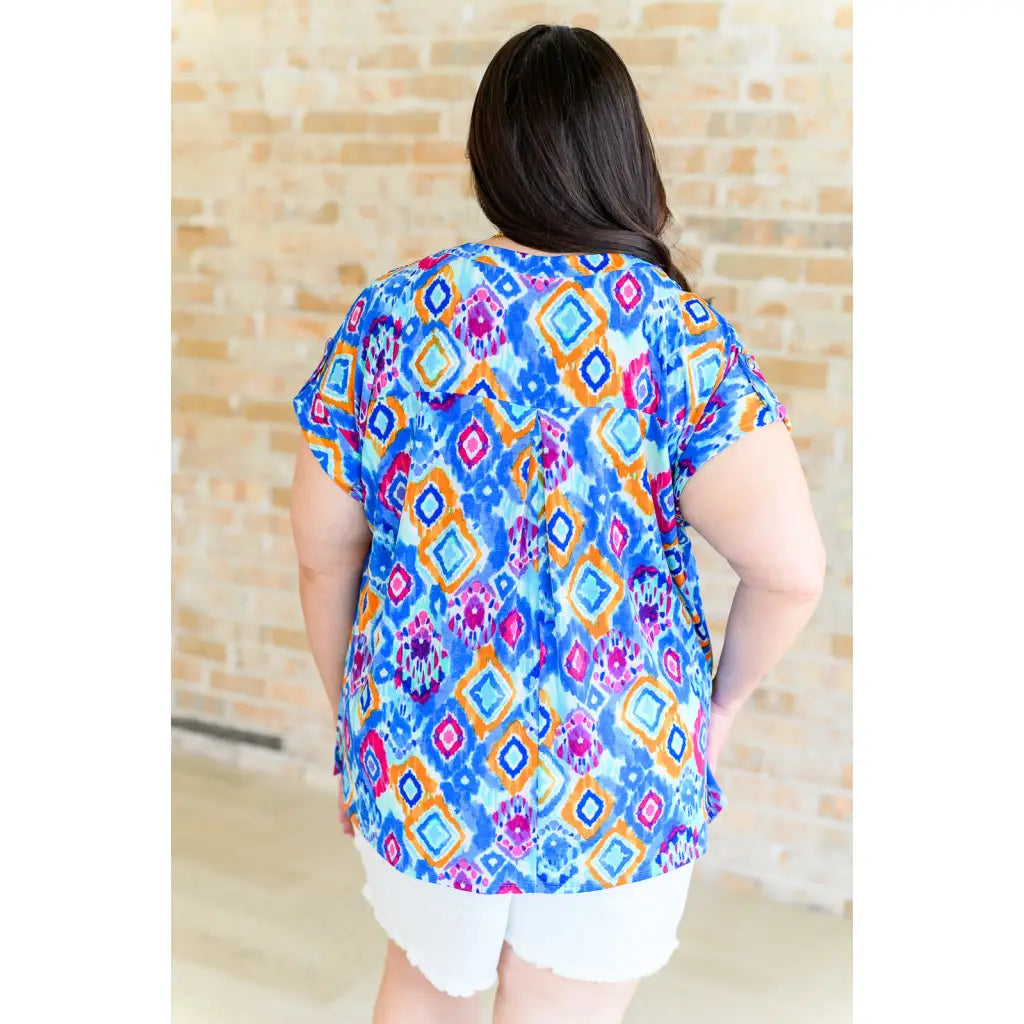 Our Lizzy Cap Sleeve Top in Blue and Magenta Ikat is crafted from light-weight cooling stretchy wrinkle-resistant