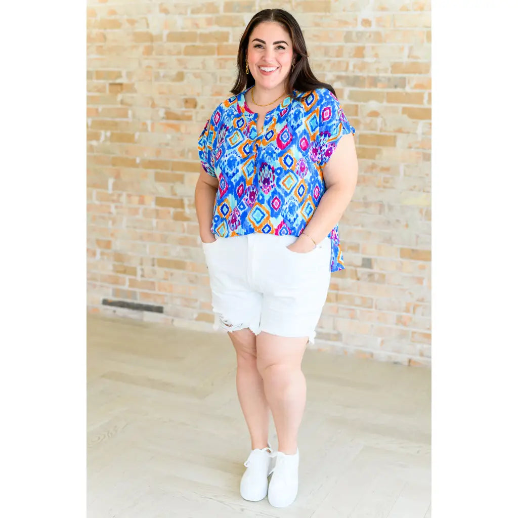 Our Lizzy Cap Sleeve Top in Blue and Magenta Ikat is crafted from light-weight cooling stretchy wrinkle-resistant