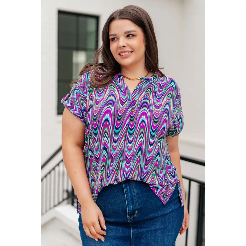 Revamp your wardrobe with our Lizzy Cap Sleeve Top in Purple Multi Marble. Crafted from wrinkle resistant light-weight