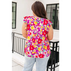 Add some flair to your wardrobe with our Lizzy Flutter Sleeve Top! This playful and bright magenta yellow floral top