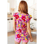 Add some flair to your wardrobe with our Lizzy Flutter Sleeve Top! This playful and bright magenta yellow floral top