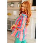 Transform your closet with our Lizzy Top in Ombre Mint Stripe. Made from wrinkle-free and stretchy Bulgari fabric