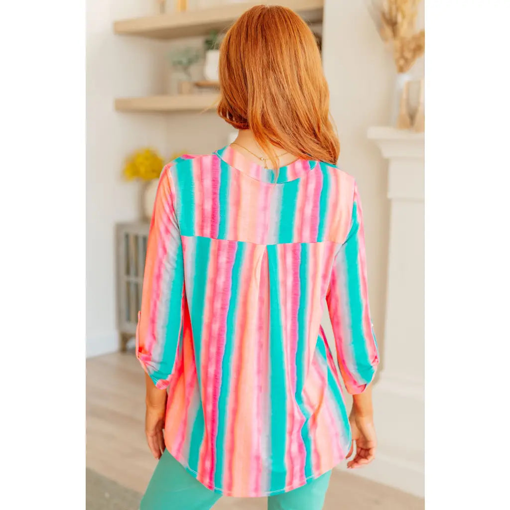 Transform your closet with our Lizzy Top in Ombre Mint Stripe. Made from wrinkle-free and stretchy Bulgari fabric