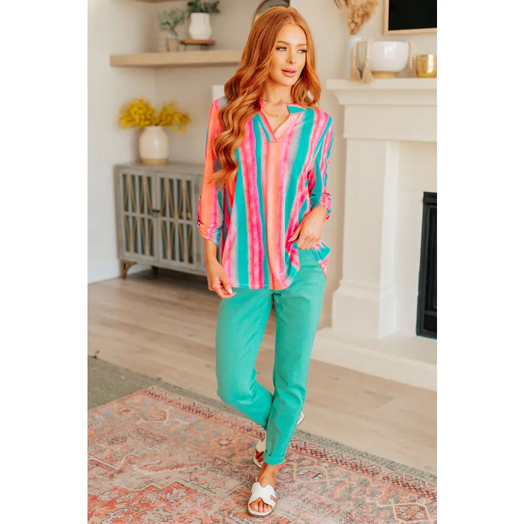 Transform your closet with our Lizzy Top in Ombre Mint Stripe. Made from wrinkle-free and stretchy Bulgari fabric