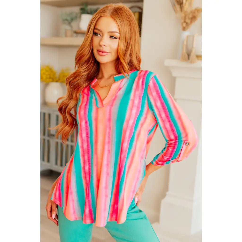 Transform your closet with our Lizzy Top in Ombre Mint Stripe. Made from wrinkle-free and stretchy Bulgari fabric