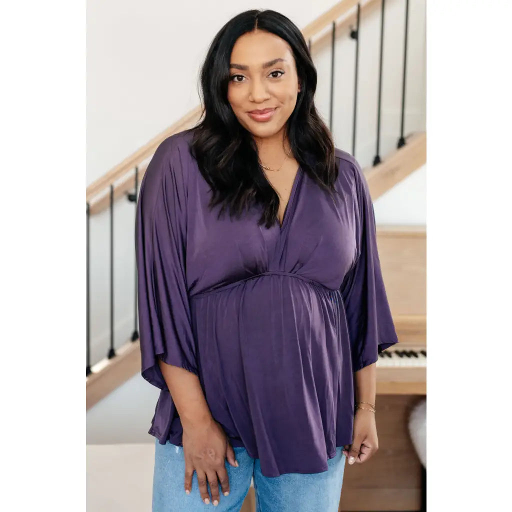 Switch up your wardrobe with this Love On The Line Purple Peplum Blouse! Made from a slinky knit beautiful purple
