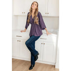 Switch up your wardrobe with this Love On The Line Purple Peplum Blouse! Made from a slinky knit beautiful purple