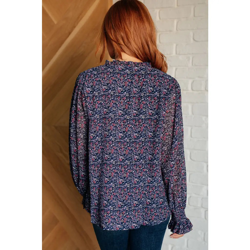 Add a touch of dreamy romance with our Lucid Dream Ruffle Neckline Blouse in Navy. Made crinkle woven fabric ditsy