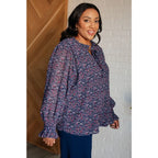 Add a touch of dreamy romance with our Lucid Dream Ruffle Neckline Blouse in Navy. Made crinkle woven fabric ditsy