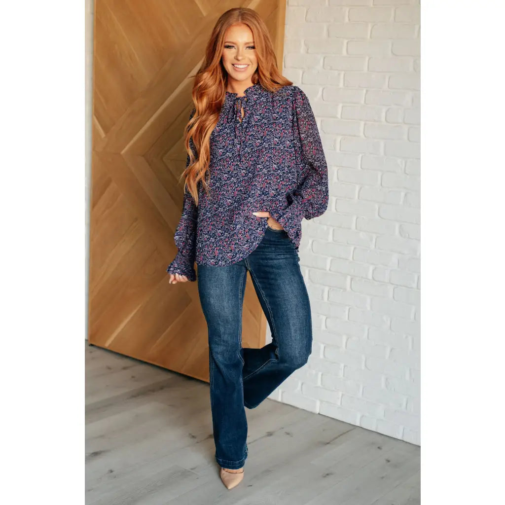 Add a touch of dreamy romance with our Lucid Dream Ruffle Neckline Blouse in Navy. Made crinkle woven fabric ditsy