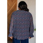 Add a touch of dreamy romance with our Lucid Dream Ruffle Neckline Blouse in Navy. Made crinkle woven fabric ditsy