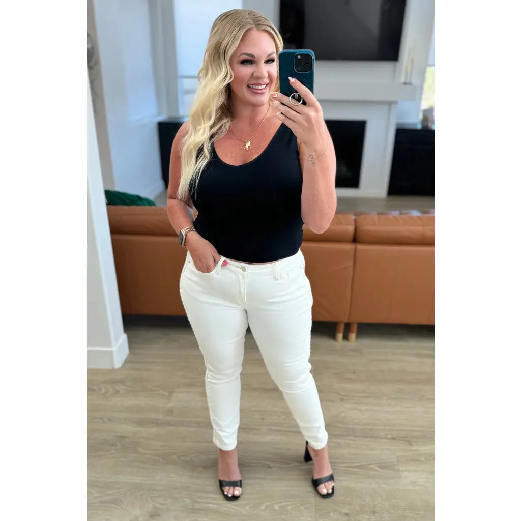 Shop Maddie Mid Rise Braided Side Seam Jeans from Judy Blue. Crisp white denim 4-way stretch braided detail relaxed