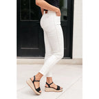 Shop Maddie Mid Rise Braided Side Seam Jeans from Judy Blue. Crisp white denim 4-way stretch braided detail relaxed