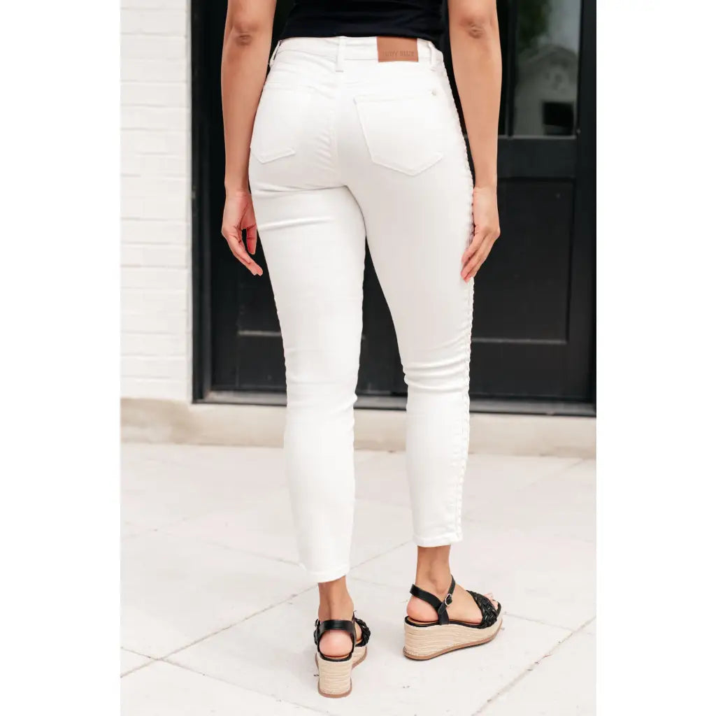 Shop Maddie Mid Rise Braided Side Seam Jeans from Judy Blue. Crisp white denim 4-way stretch braided detail relaxed