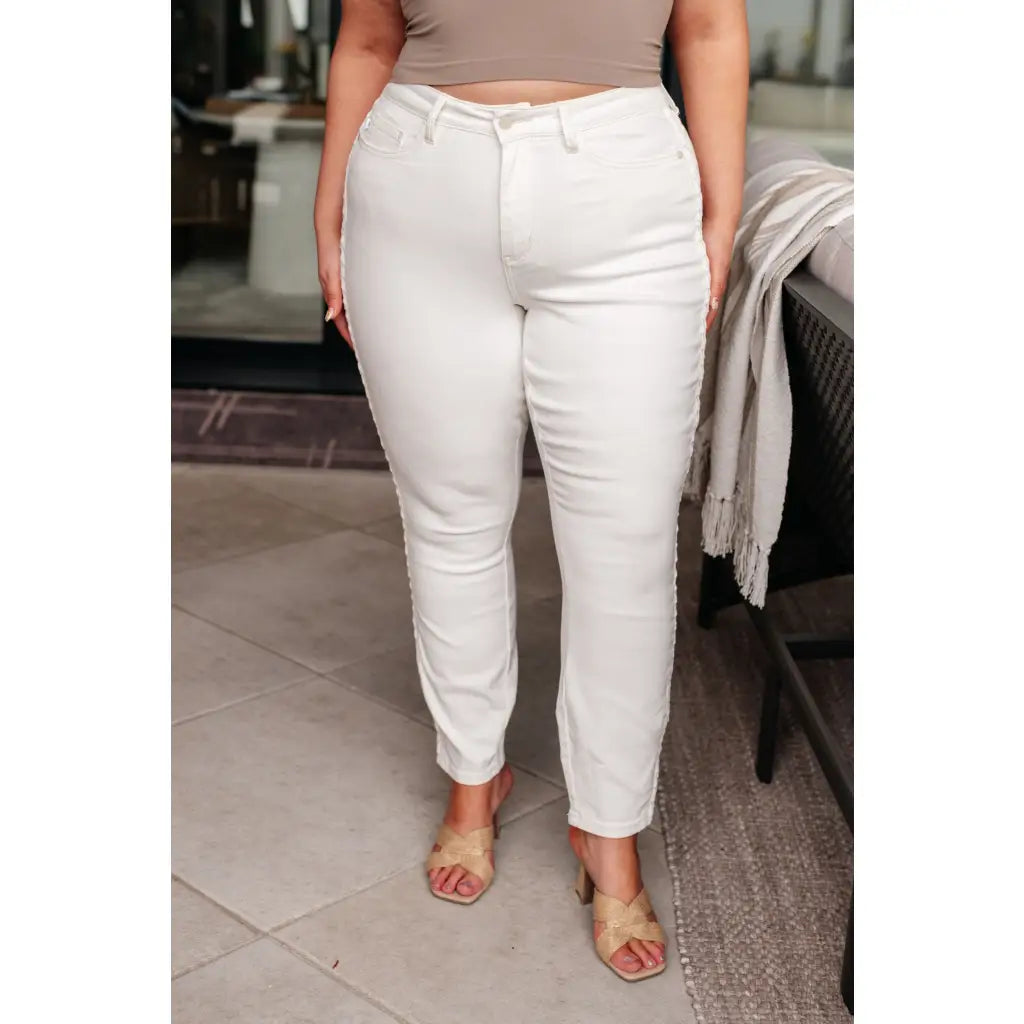 Shop Maddie Mid Rise Braided Side Seam Jeans from Judy Blue. Crisp white denim 4-way stretch braided detail relaxed