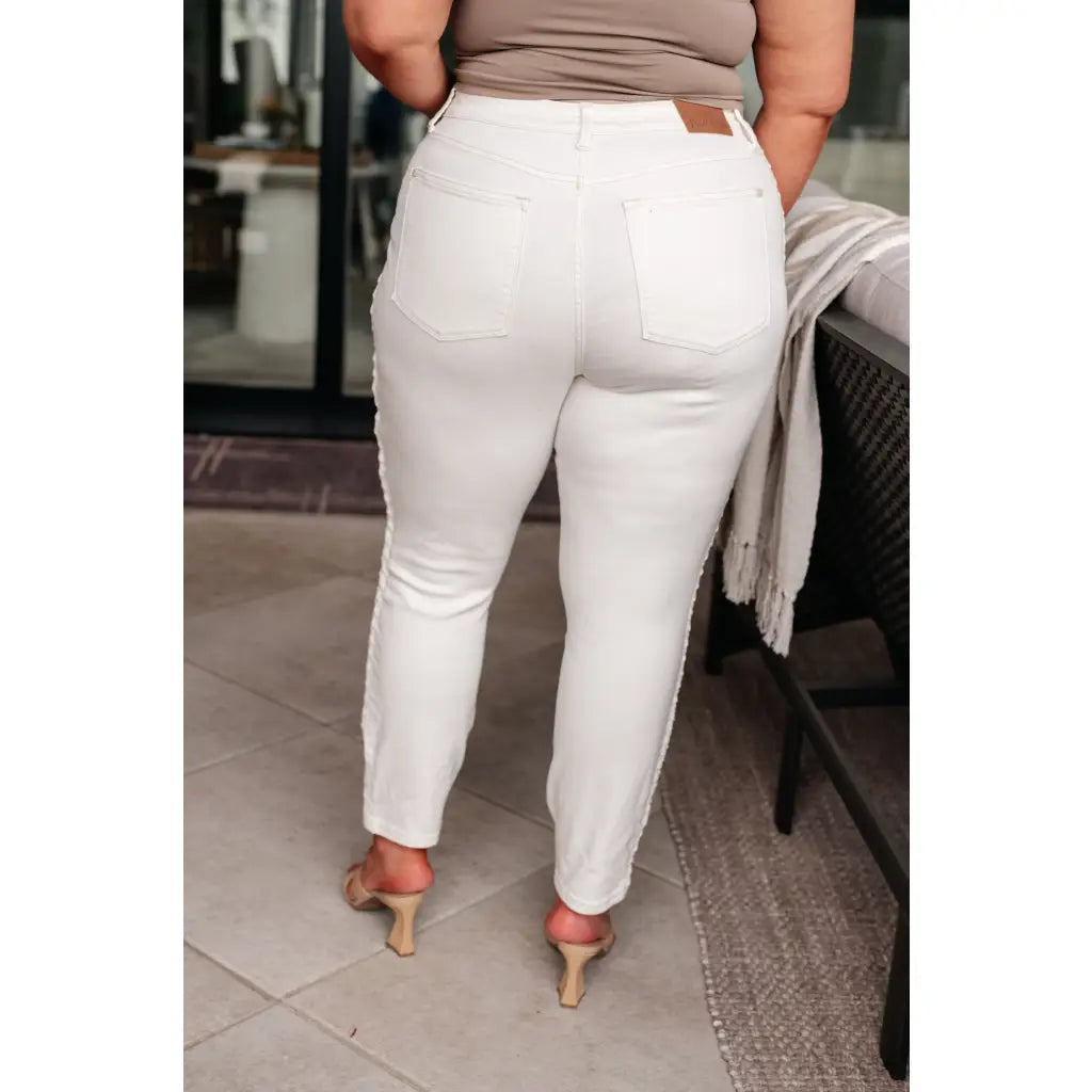 Shop Maddie Mid Rise Braided Side Seam Jeans from Judy Blue. Crisp white denim 4-way stretch braided detail relaxed